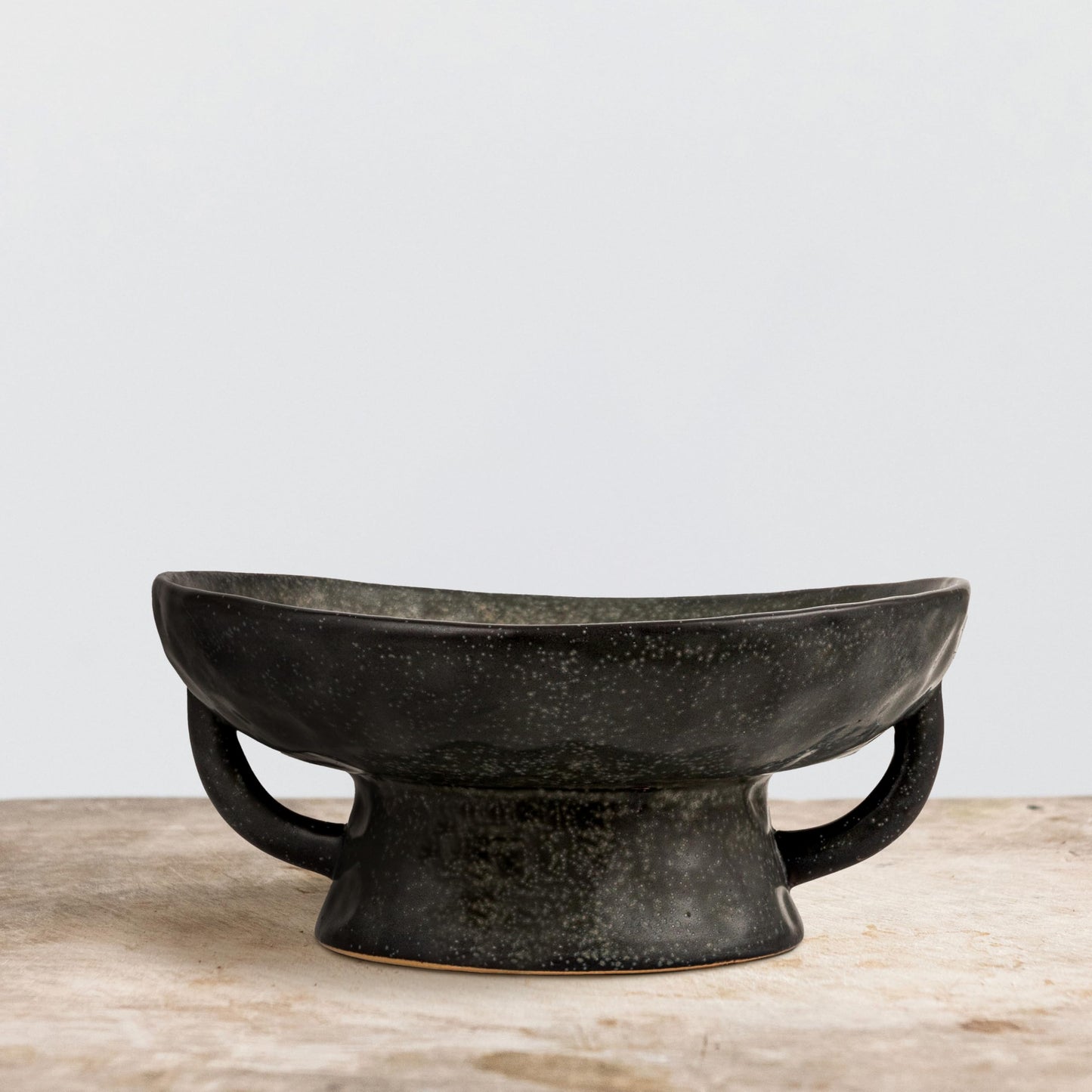 Creative Co-Op Stoneware Bowl with Handle and Base, Black Reactive Glaze